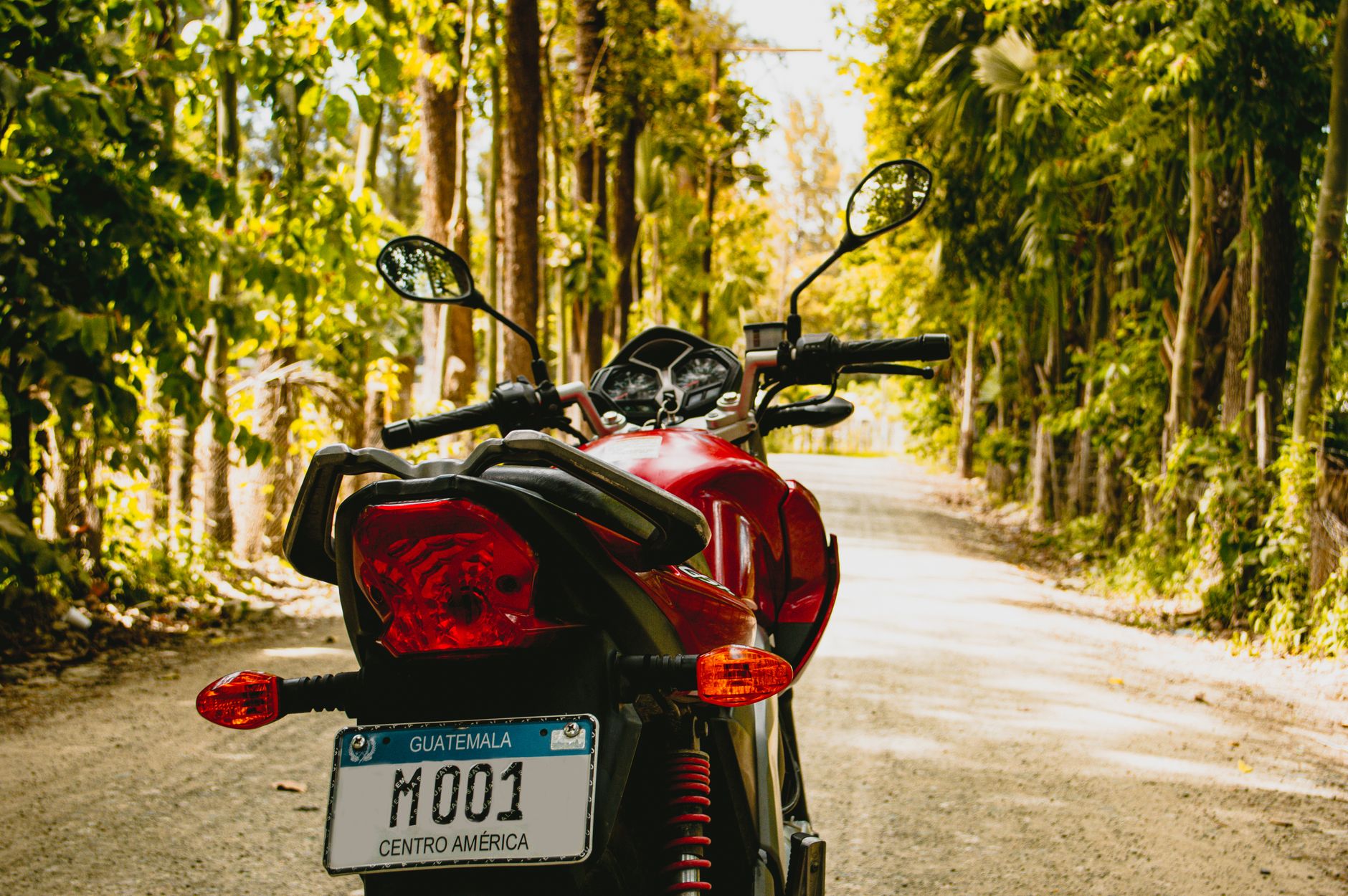 Motorcycle parked on a road, illustrating the budget needed for the A2 licence